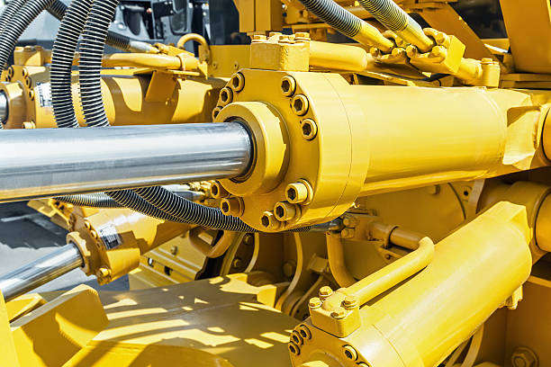 hydraulics tractor yellow. focus on the hydraulic pipes